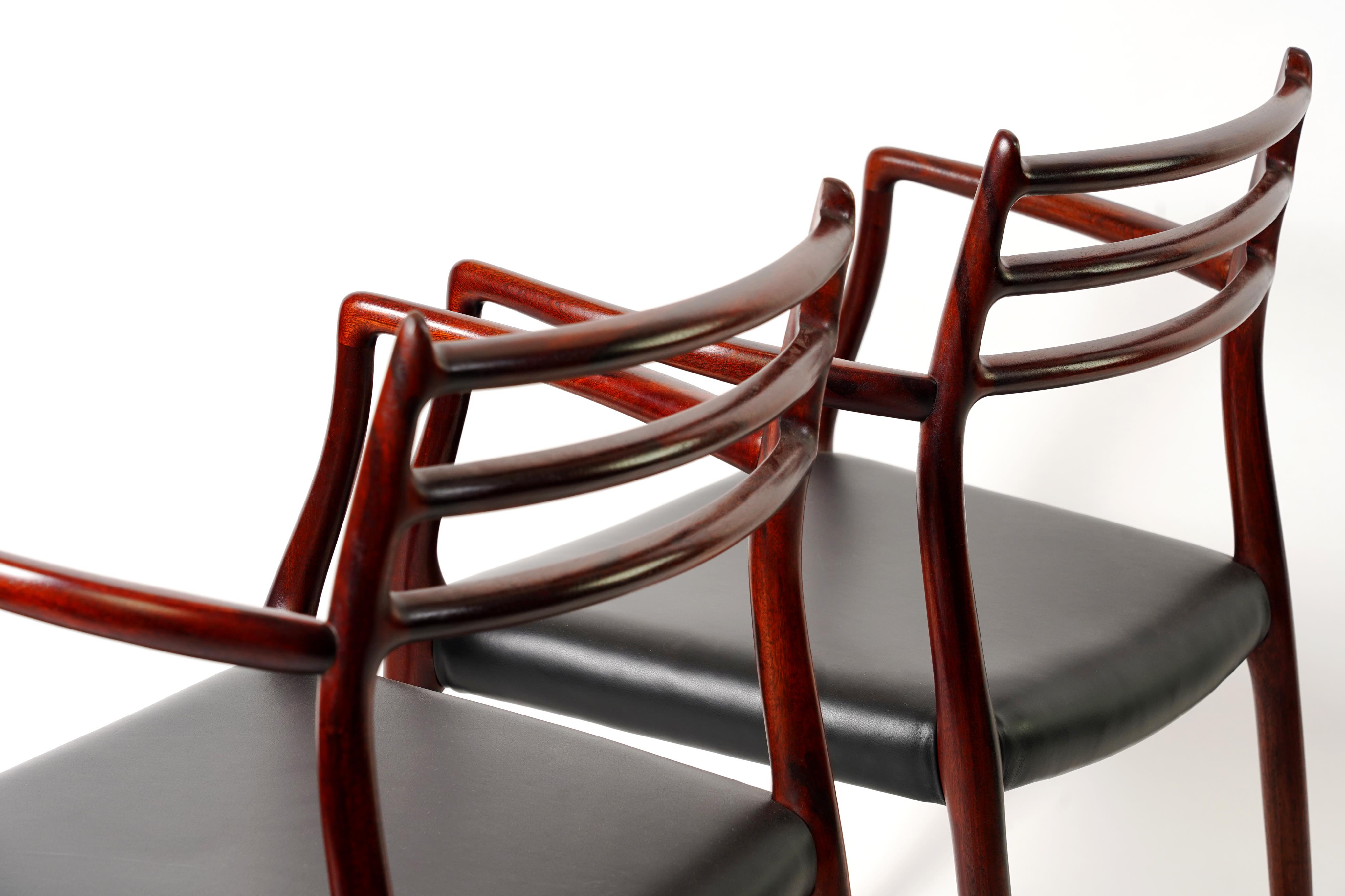 Niels Otto Møller (Danish, 1920-1982) for JL Møllers Møbelfabrik: A pair of 'Model 62' carver chairs